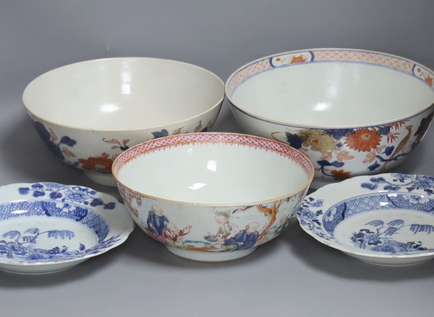 Three 18th century Chinese export porcelain bowls, largest 28 cm and two plates